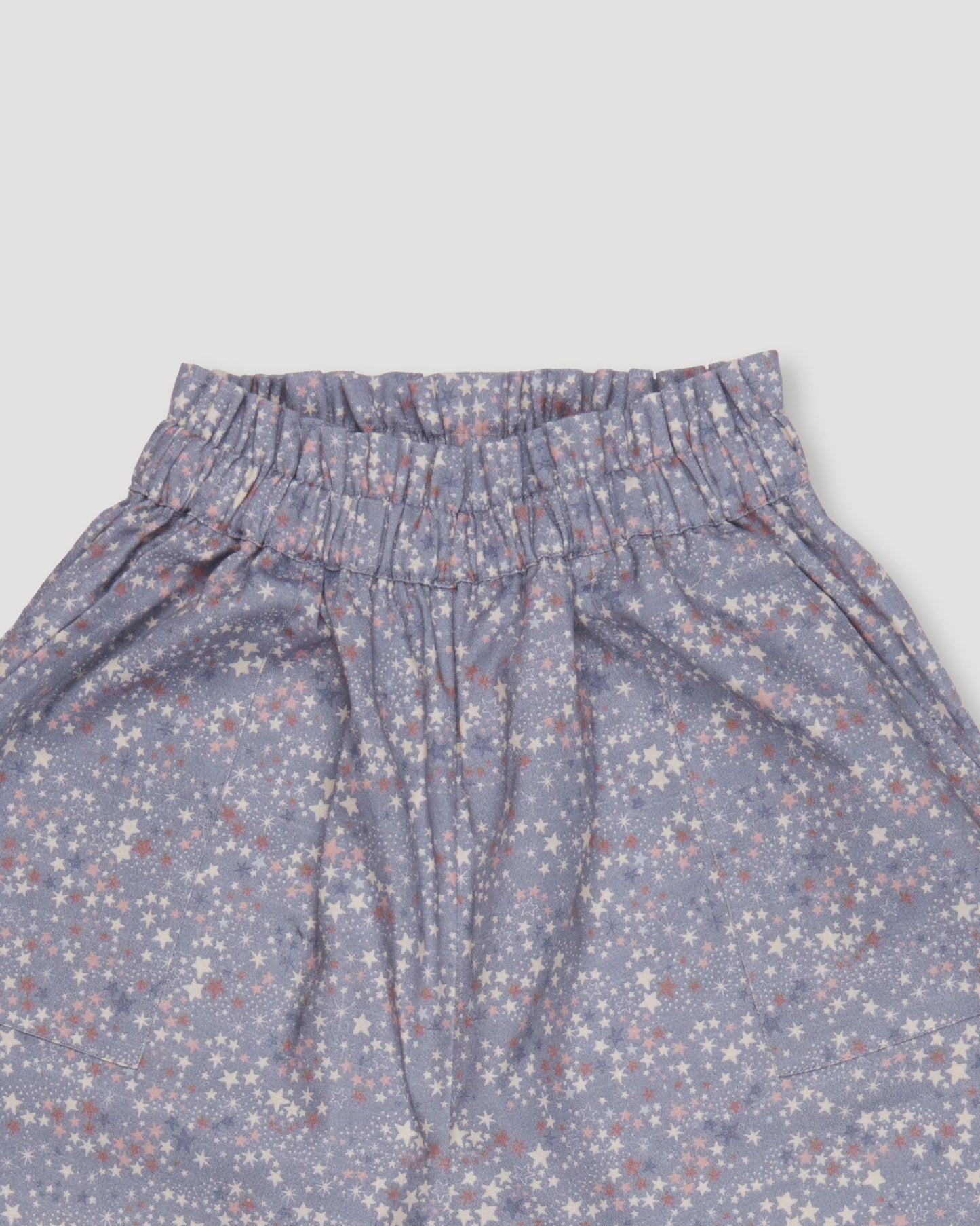 Early Sunday, Adrien Trouser in Celestial print, made from Printed 30s Cotton Twill fabric, featuring Relaxed design with ample room for movement, perfect for active kids, shown in a closeup flat-lay view