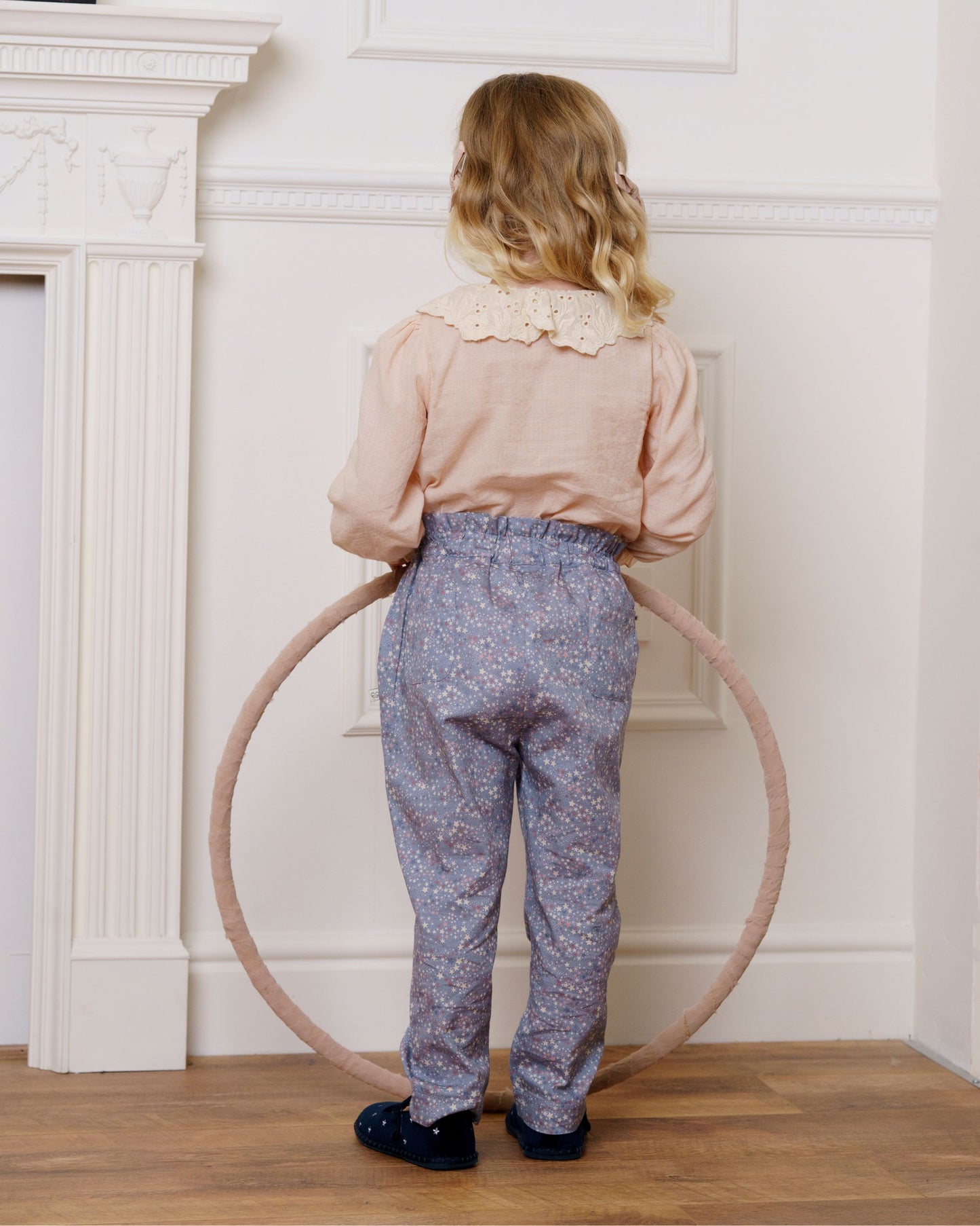 Early Sunday, Adrien Trouser in Celestial print, made from Printed 30s Cotton Twill fabric, featuring Relaxed design with ample room for movement, perfect for active kids, shown in a back view of model wearing it