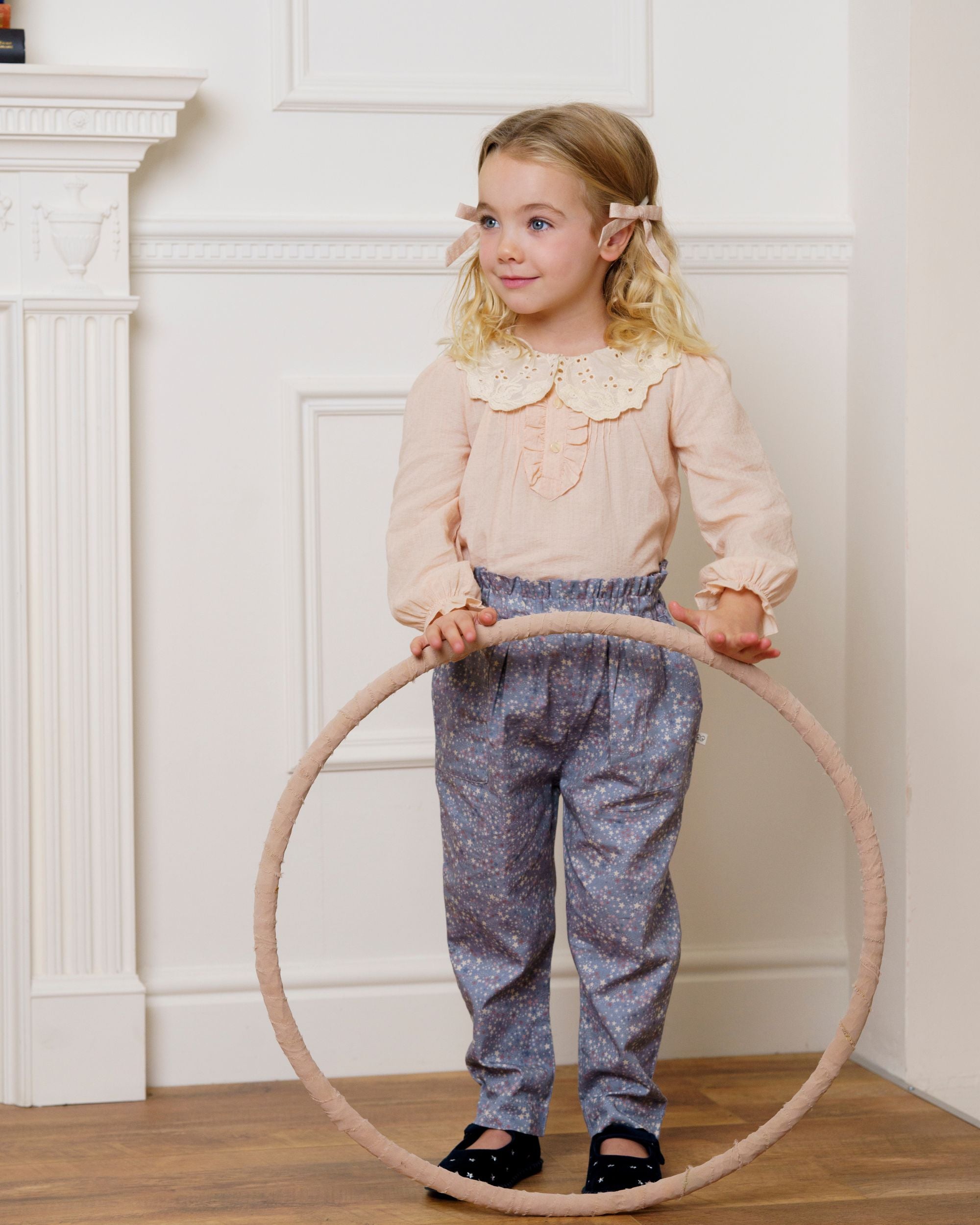 Early Sunday, Adrien Trouser in Celestial print, made from Printed 30s Cotton Twill fabric, featuring Relaxed design with ample room for movement, perfect for active kids, shown in a front view of model wearing it