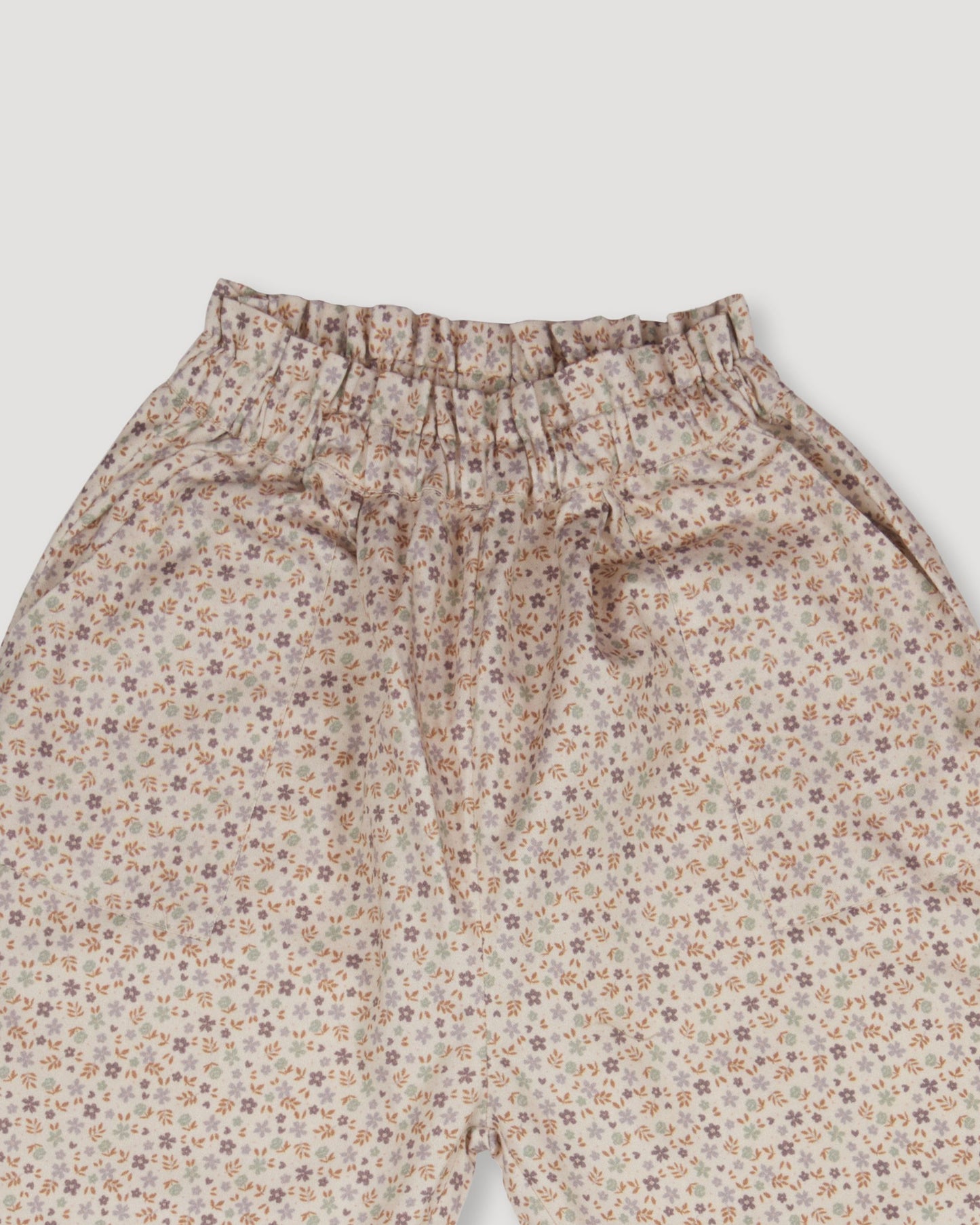 Early Sunday, Adrien Trouser in Floral print, made from Printed 30s Cotton Twill fabric, featuring Relaxed design with ample room for movement, perfect for active kids, shown in a closeup flat-lay view