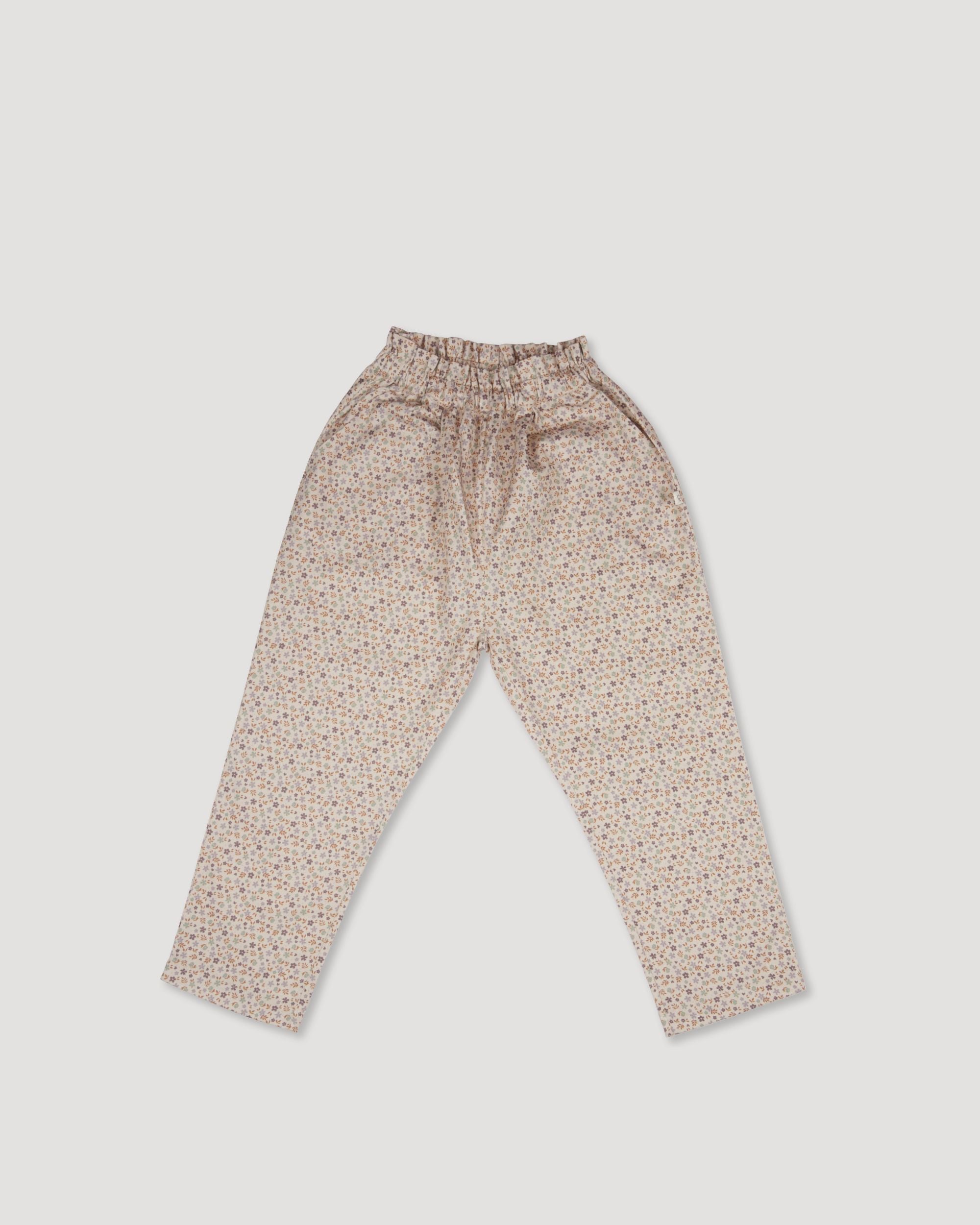 Early Sunday, Adrien Trouser in Floral print, made from Printed 30s Cotton Twill fabric, featuring Relaxed design with ample room for movement, perfect for active kids, shown in a front flat-lay view