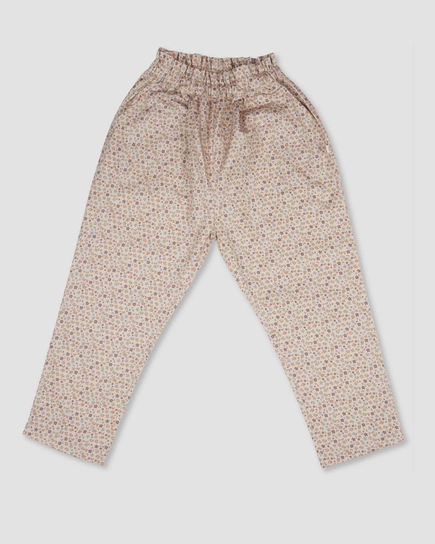 Early Sunday, Adrien Trouser in Miny Flowers print, made from Printed 30s Cotton Twill fabric, featuring Relaxed design with ample room for movement, perfect for active kids, shown in a back flat-lay view