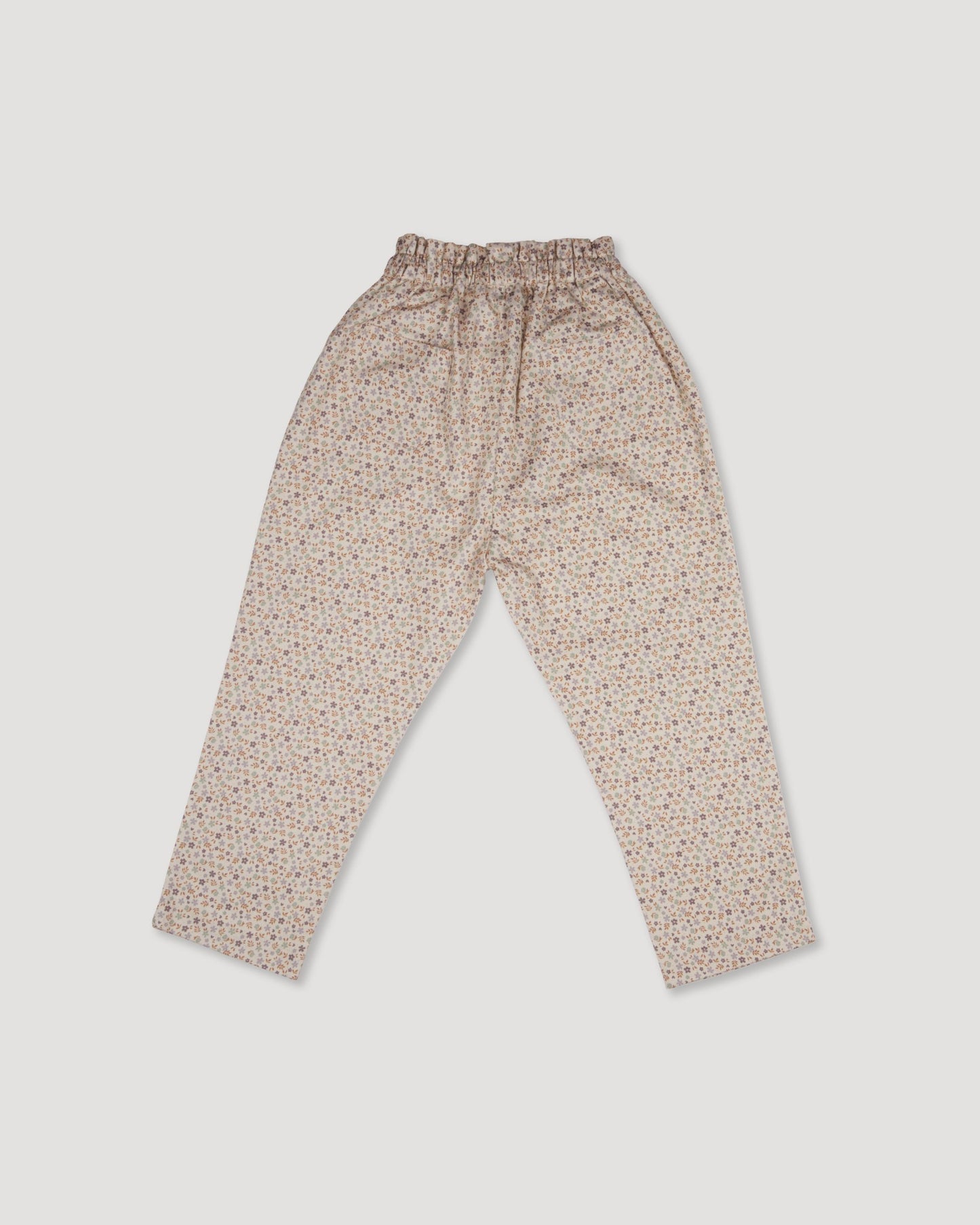 Early Sunday, Adrien Trouser in Miny Flowers print, made from Printed 30s Cotton Twill fabric, featuring Relaxed design with ample room for movement, perfect for active kids, shown in a front flat-lay view