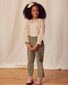 Early Sunday, Adrin Trouser in Moss, made from Cotton Corduroy fabric, featuring a relaxed silhouette with a comfortable elastic waistband, shown in a front view of model wearing it