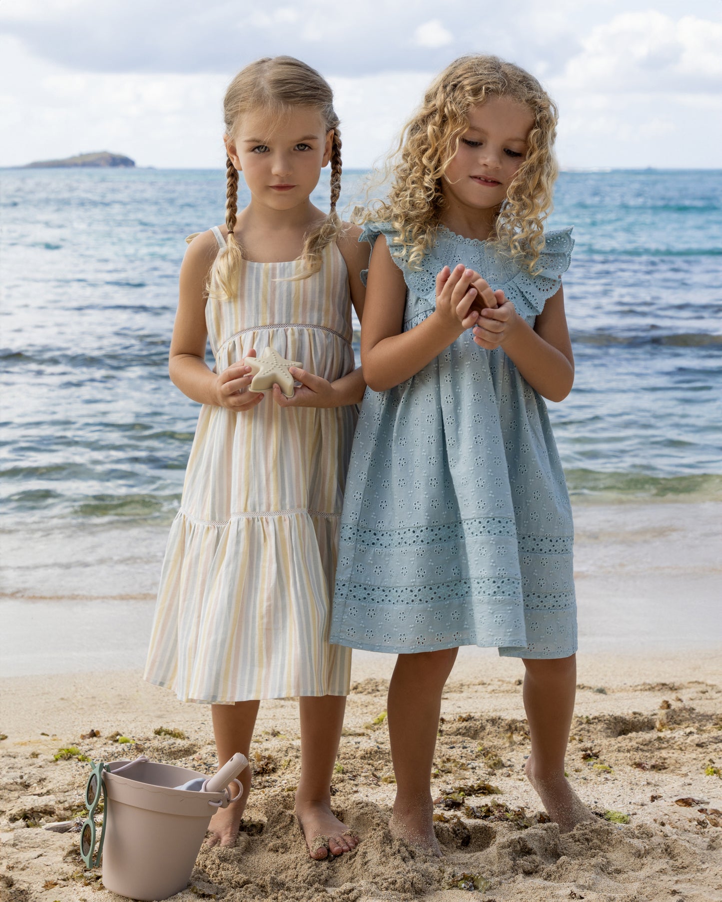 Early Sunday, Alice Dress in Summer Stripe, made from Printed canvas 70% Cotton 30% Linen fabric, featuring sleeveless with adjustable tie-up straps and a tiered silhouette, shown in a front view of model wearing it