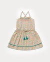 Early Sunday, Alisson Dress in Emma Floral Mint color, made from organic printed cotton cambric fabric, featuring smocked bodice, adjustable shoulder straps, sweet tassel accents, and a flowy gathered skirt, shown in a front flat-lay view.