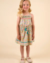 Early Sunday, Alisson Dress in Emma Floral Mint color, made from organic printed cotton cambric fabric, featuring smocked bodice, adjustable shoulder straps, sweet tassel accents, and a flowy gathered skirt, shown in a front view of model wearing.