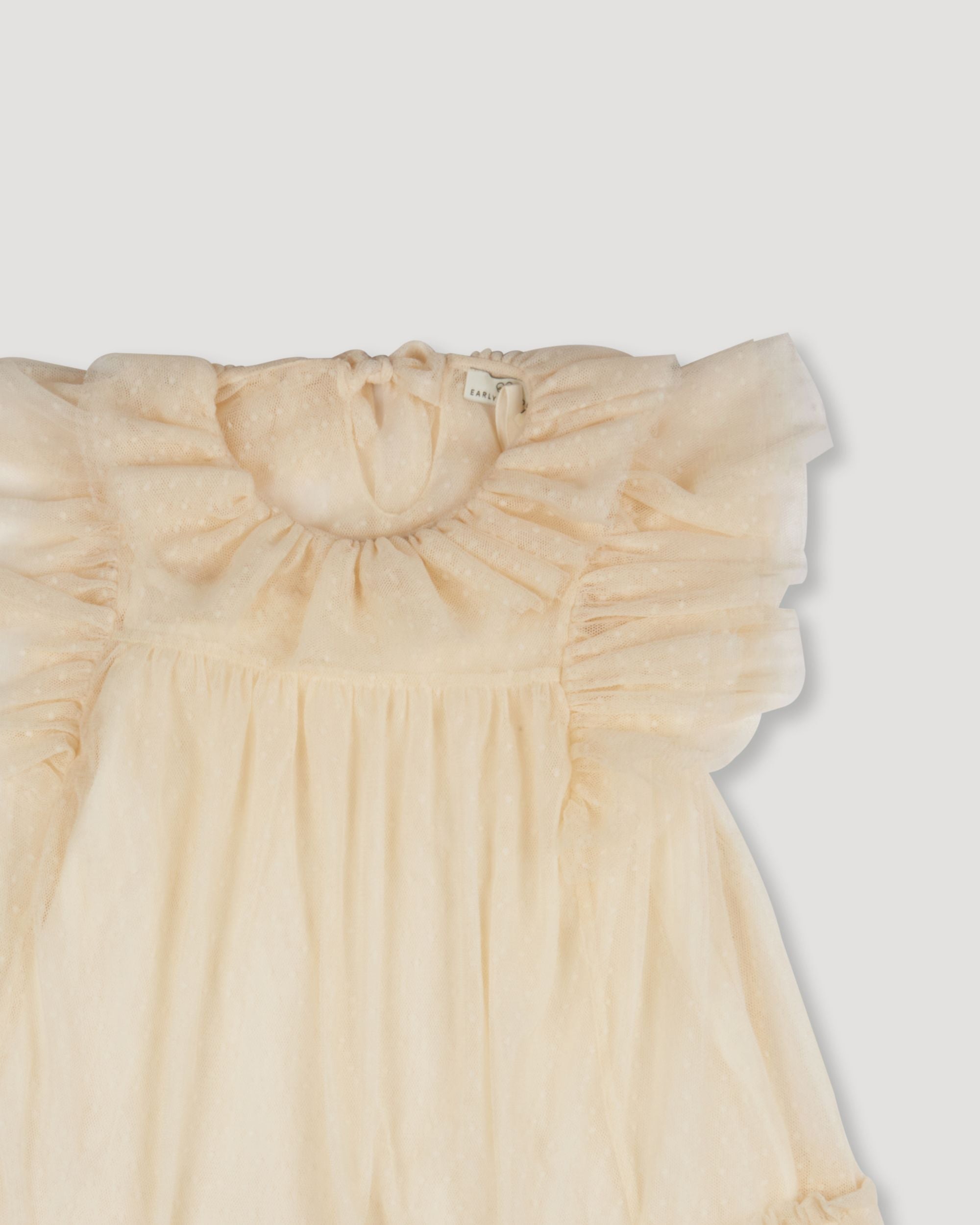 Early Sunday, Angel Baby Dress & Bloomer Set in Hazelnut Cream color, made from Dyed Nylon Mesh Dobby fabric, featuring a dobby mesh, fluttery sleeves & gentle gathers, shown in a closeup flat-lay view