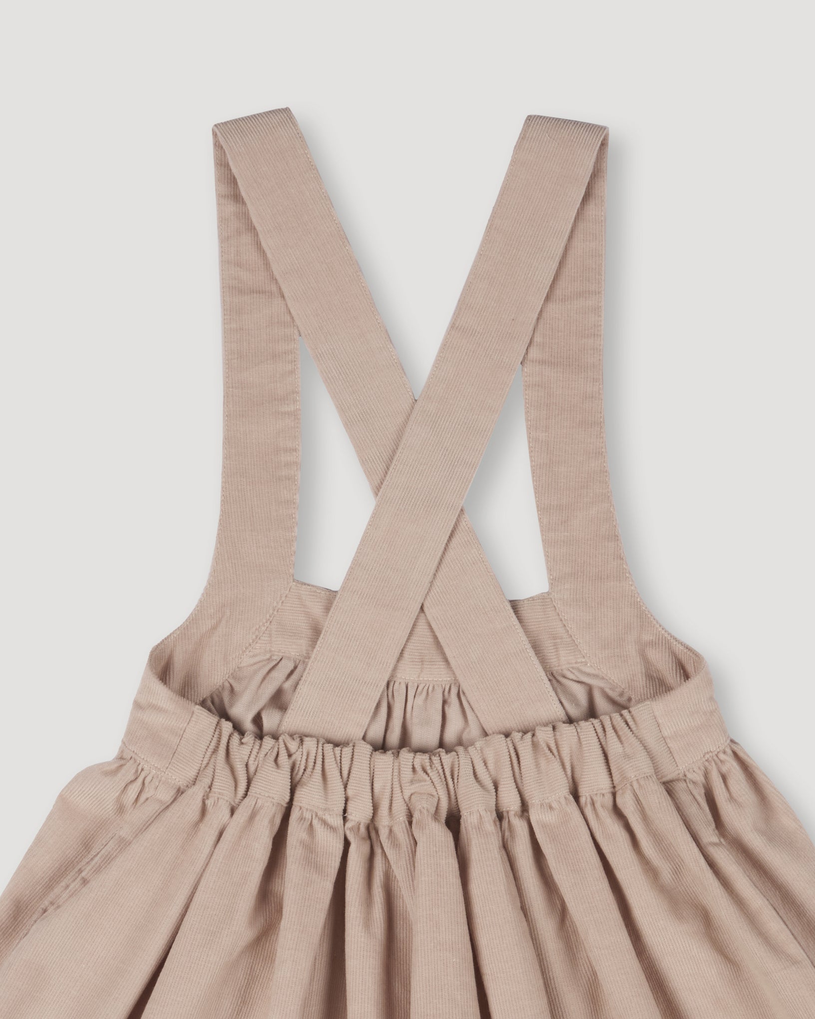 Early Sunday, Annie Skirt in Beige color, made from Cotton Corduroy fabric, featuring a relaxed fit with an elastic waistband & beautiful embroidery, shown in a closeup flat-lay view