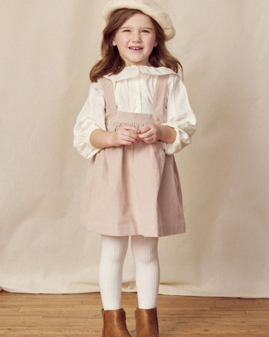 Early Sunday, Annie Skirt in Beige color, made from Cotton Corduroy fabric, featuring a relaxed fit with an elastic waistband & beautiful embroidery, shown in a front view of model wearing it