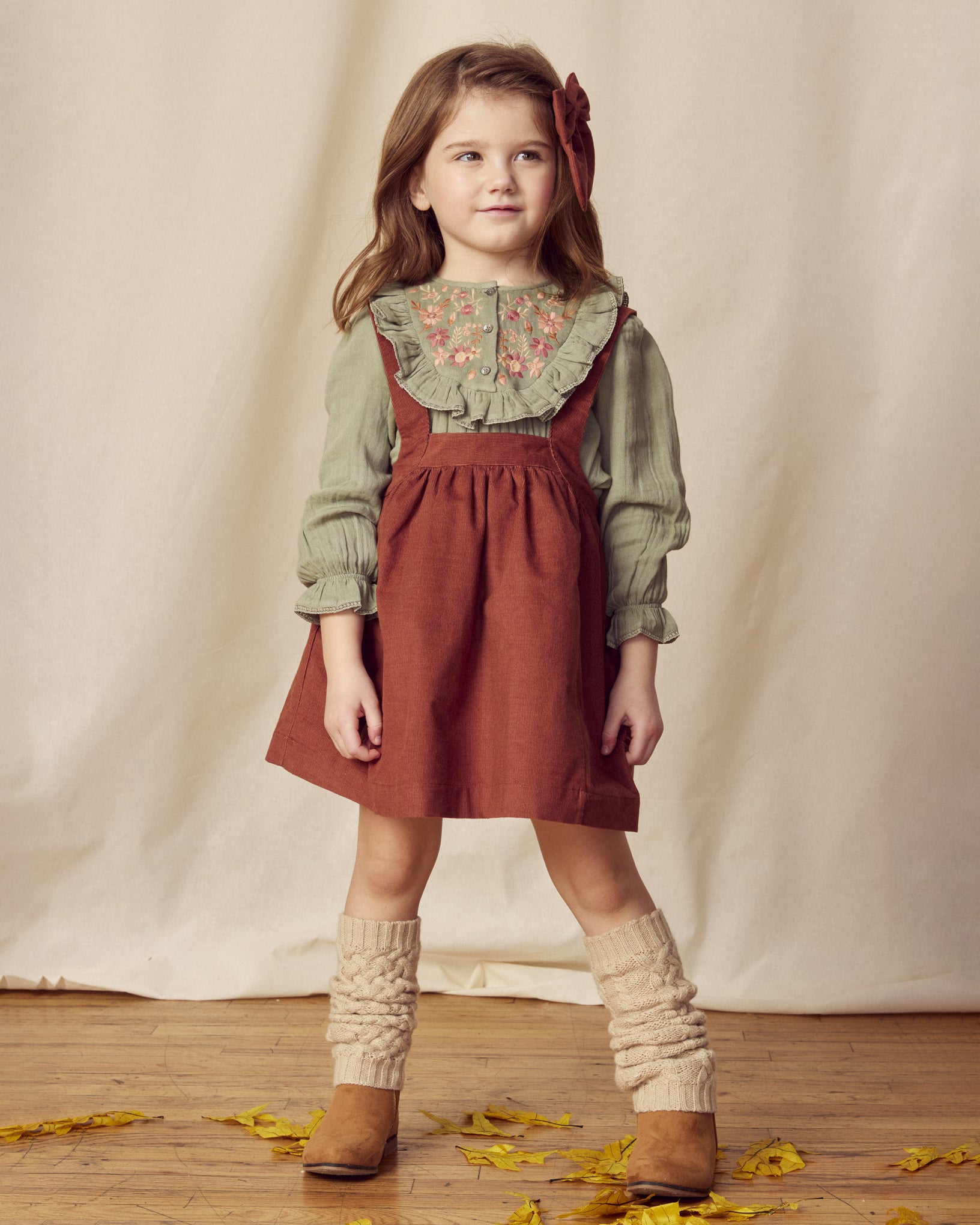 Early Sunday, Annie Skirt in Caramel, made from Cotton Corduroy fabric, featuring a relaxed fit with an elastic waistband & beautiful embroidery, shown in a front view of model wearing it