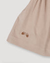 Early Sunday, Annie Skirt in Beige color, made from Cotton Corduroy fabric, featuring a relaxed fit with an elastic waistband & beautiful embroidery, shown in a close-up shot of the print