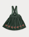 Early Sunday, Annie Skirt in Forest Green, made from Cotton Velvet Velour's fabric, featuring an A-line silhouette with adjustable cross-back straps and soft gathers, shown in a back flat-lay view