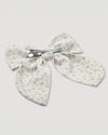 Early Sunday, Audrey Alligator Clip in Mini Flower print, made from Printed canvas 70% Cotton 30% Linen fabric, featuring a fabric bow design with a secure hair clip fastening, shown in a back flat-lay view