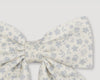 Early Sunday, Audrey Alligator Clip in Mini Flower print, made from Printed canvas 70% Cotton 30% Linen fabric, featuring a fabric bow design with a secure hair clip fastening, shown in a closeup flat-lay view