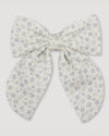 Early Sunday, Audrey Alligator Clip in Mini Flower print, made from Printed canvas 70% Cotton 30% Linen fabric, featuring a fabric bow design with a secure hair clip fastening, shown in a front flat-lay view