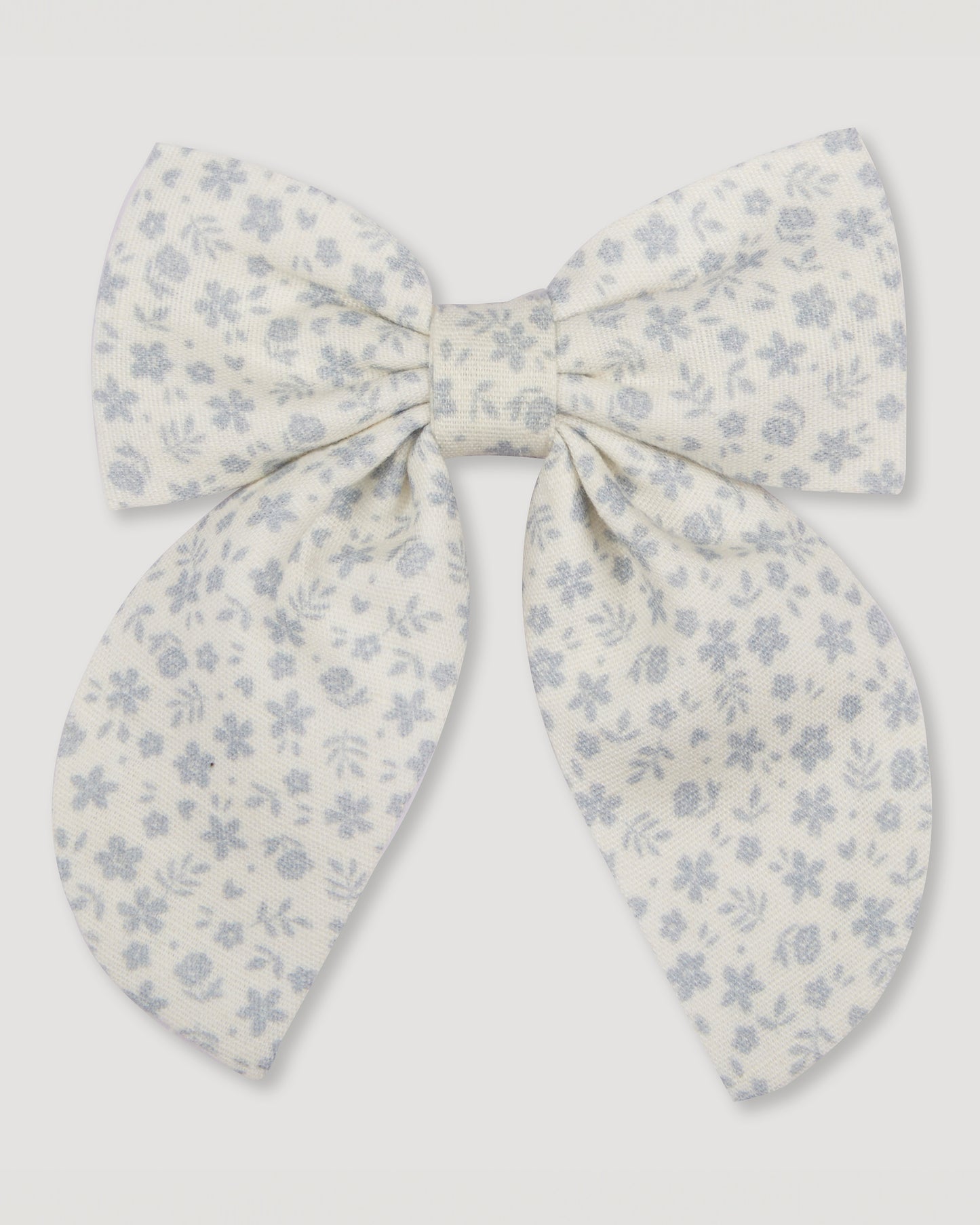 Early Sunday, Audrey Alligator Clip in Mini Flower print, made from Printed canvas 70% Cotton 30% Linen fabric, featuring a fabric bow design with a secure hair clip fastening, shown in a front flat-lay view
