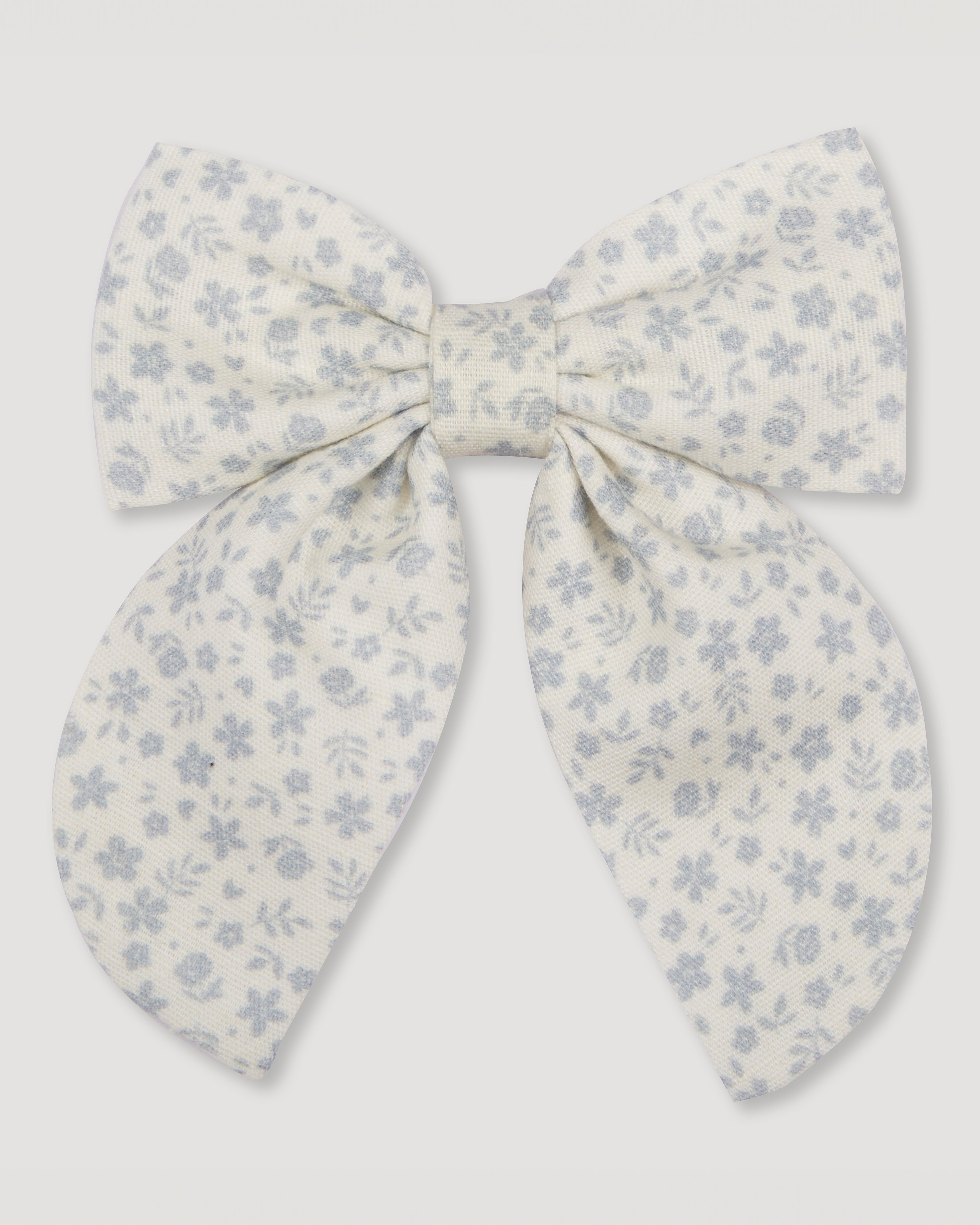 Early Sunday, Audrey Alligator Clip in Mini Flower print, made from Printed canvas 70% Cotton 30% Linen fabric, featuring a fabric bow design with a secure hair clip fastening, shown in a front flat-lay view