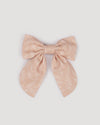 Early Sunday, Audrey Clip in Feather print, made from Printed 60s Cotton Cambric fabric, featuring a fabric bow design with a secure hair clip fastening, shown in a front flat-lay view