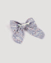 Early Sunday, Audrey Clip in Celestial print, made from Printed 60s Cotton Satin fabric, featuring a fabric bow design with a secure hair clip fastening, shown in a back flat-lay view