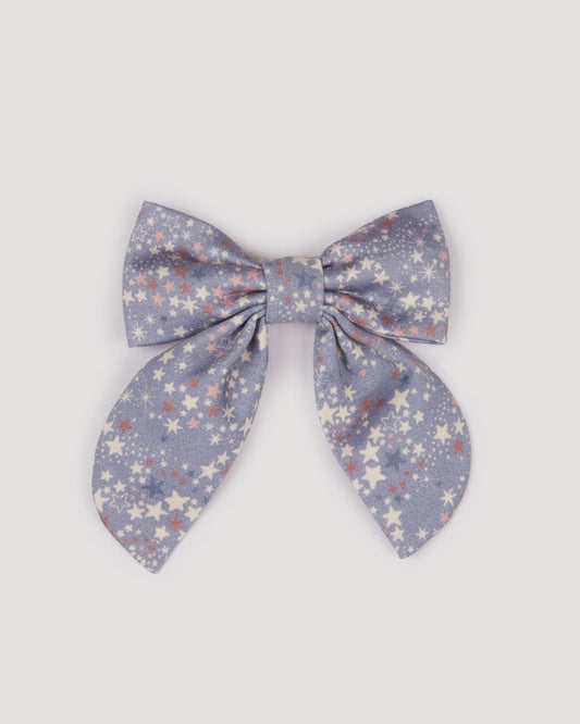 Early Sunday, Audrey Clip in Celestial print, made from Printed 60s Cotton Satin fabric, featuring a fabric bow design with a secure hair clip fastening, shown in a front flat-lay view