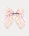 Early Sunday, Audrey Clip in Pink Stripes print, made from Printed 70% Cotton, 30% Linen fabric, featuring a fabric bow design with a secure hair clip fastening, shown in a back flat-lay view