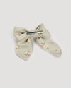 Early Sunday, Audrey Clip in Ditsy Bouquet Jade print, made from Printed Viscose Twill fabric, featuring a fabric bow design with a secure hair clip fastening, shown in a back flat-lay view