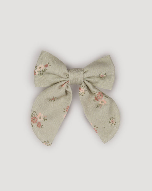 Early Sunday, Audrey Clip in Ditsy Bouquet Jade print, made from Printed Viscose Twill fabric, featuring a fabric bow design with a secure hair clip fastening, shown in a front flat-lay view