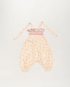Early Sunday, Audrey Overall Baby Romper in Butterflies print, made from 100% Cotton Swiss Dobby Tiny Dots fabric, featuring tie-up shoulder straps with dot texture & smocked waistband, shown in a front flat-lay view