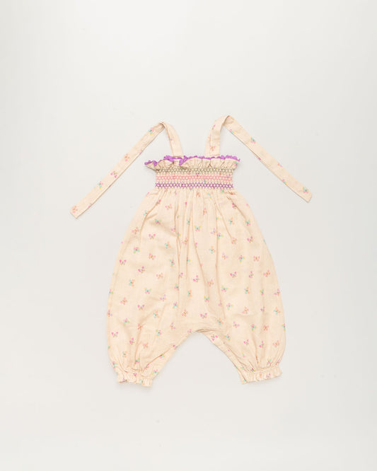 Early Sunday, Audrey Overall Baby Romper in Butterflies print, made from 100% Cotton Swiss Dobby Tiny Dots fabric, featuring tie-up shoulder straps with dot texture & smocked waistband, shown in a front flat-lay view