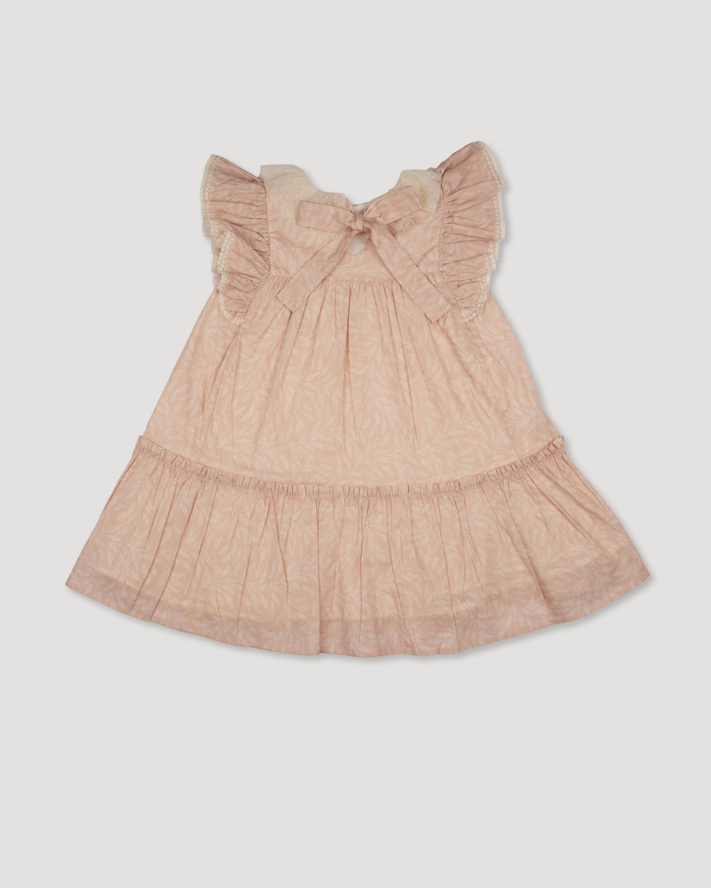 Early Sunday, Aurelia Dress in Feather print, made from Printed Cotton Cambric fabric, featuring Layered ruffles with flutter sleeves, shown in a back flat-lay view