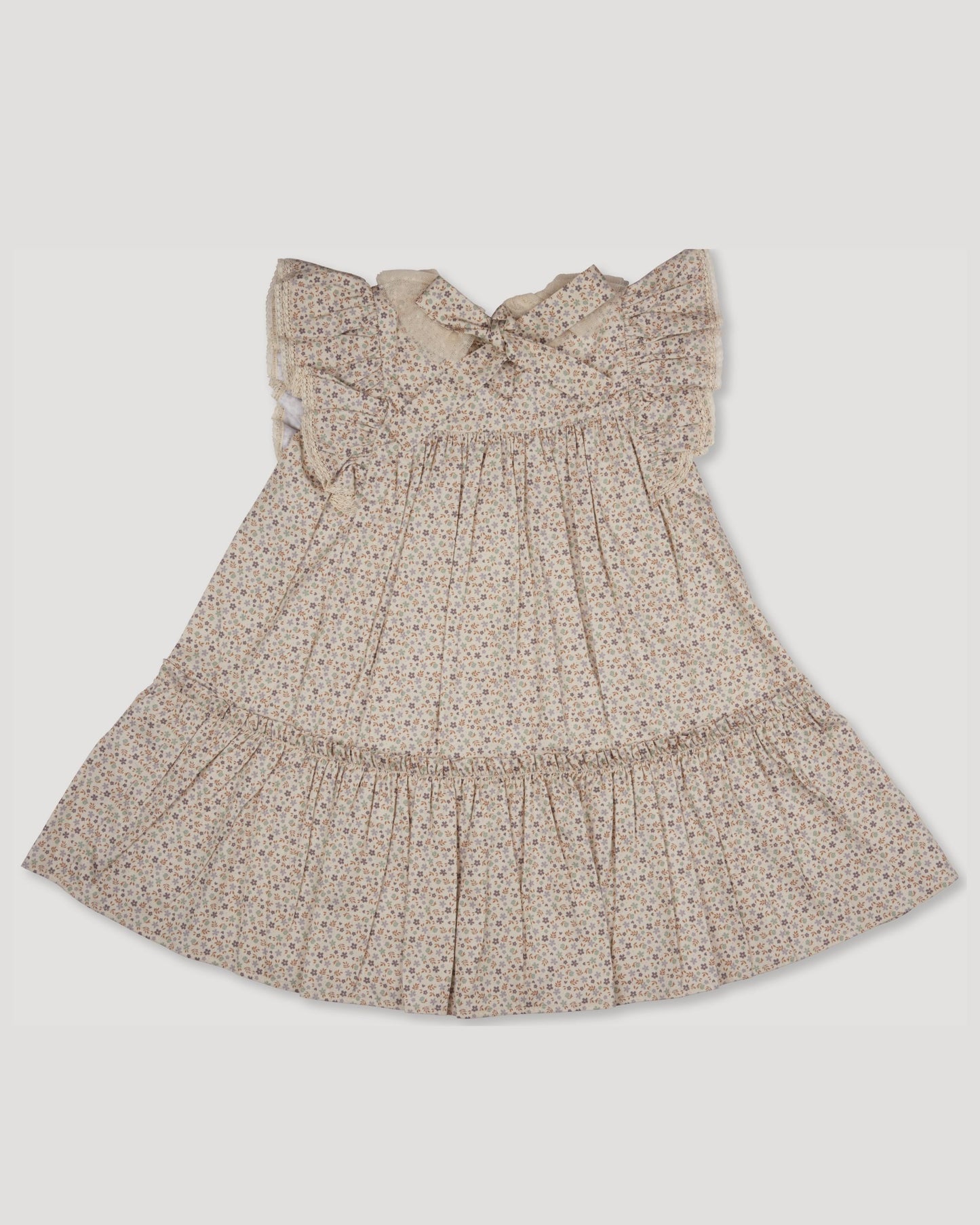 Early Sunday, Aurelia Dress in Miny Flowers print, made from Printed Cotton Satin fabric, featuring Layered ruffles with flutter sleeves, shown in a back flat-lay view