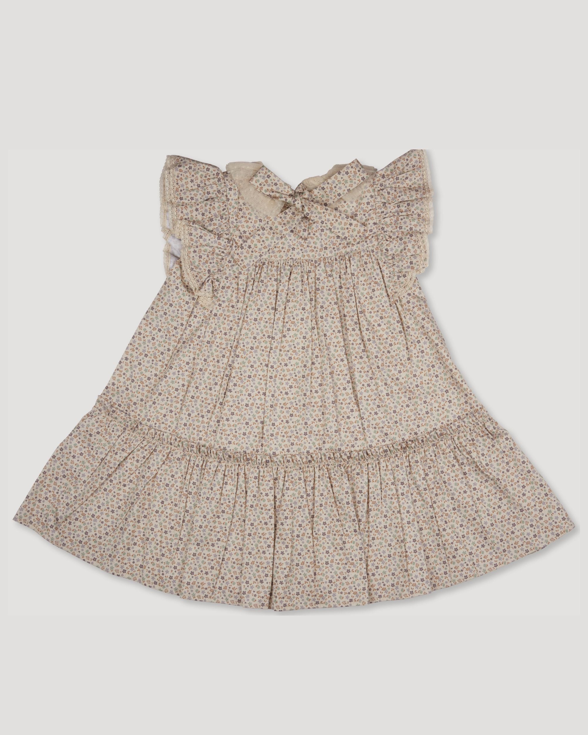 Early Sunday, Aurelia Dress in Miny Flowers print, made from Printed Cotton Satin fabric, featuring Layered ruffles with flutter sleeves, shown in a back flat-lay view