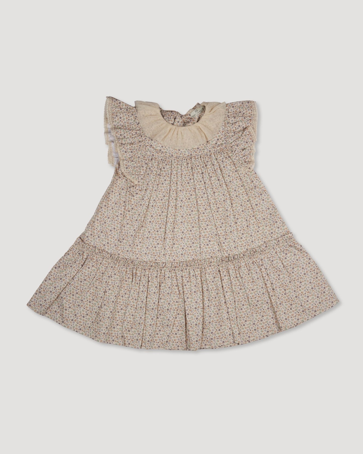 Early Sunday, Aurelia Dress in Miny Flowers print, made from Printed Cotton Satin fabric, featuring Layered ruffles with flutter sleeves, shown in a front flat-lay view