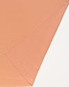 Early Sunday, Baby Napkin in Candy Floss color, made from Printed Cotton Double Gauze fabric, shown in a closeup flat-lay view