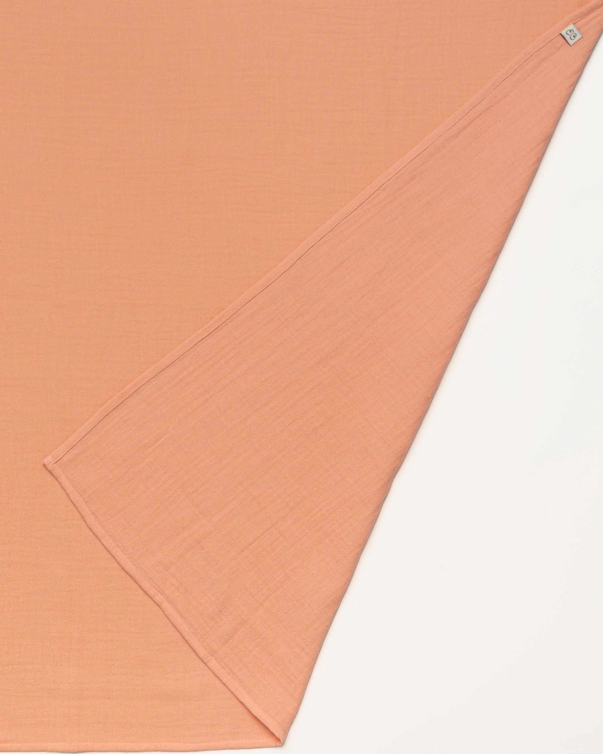 Early Sunday, Baby Napkin in Candy Floss color, made from Printed Cotton Double Gauze fabric, shown in a closeup flat-lay view
