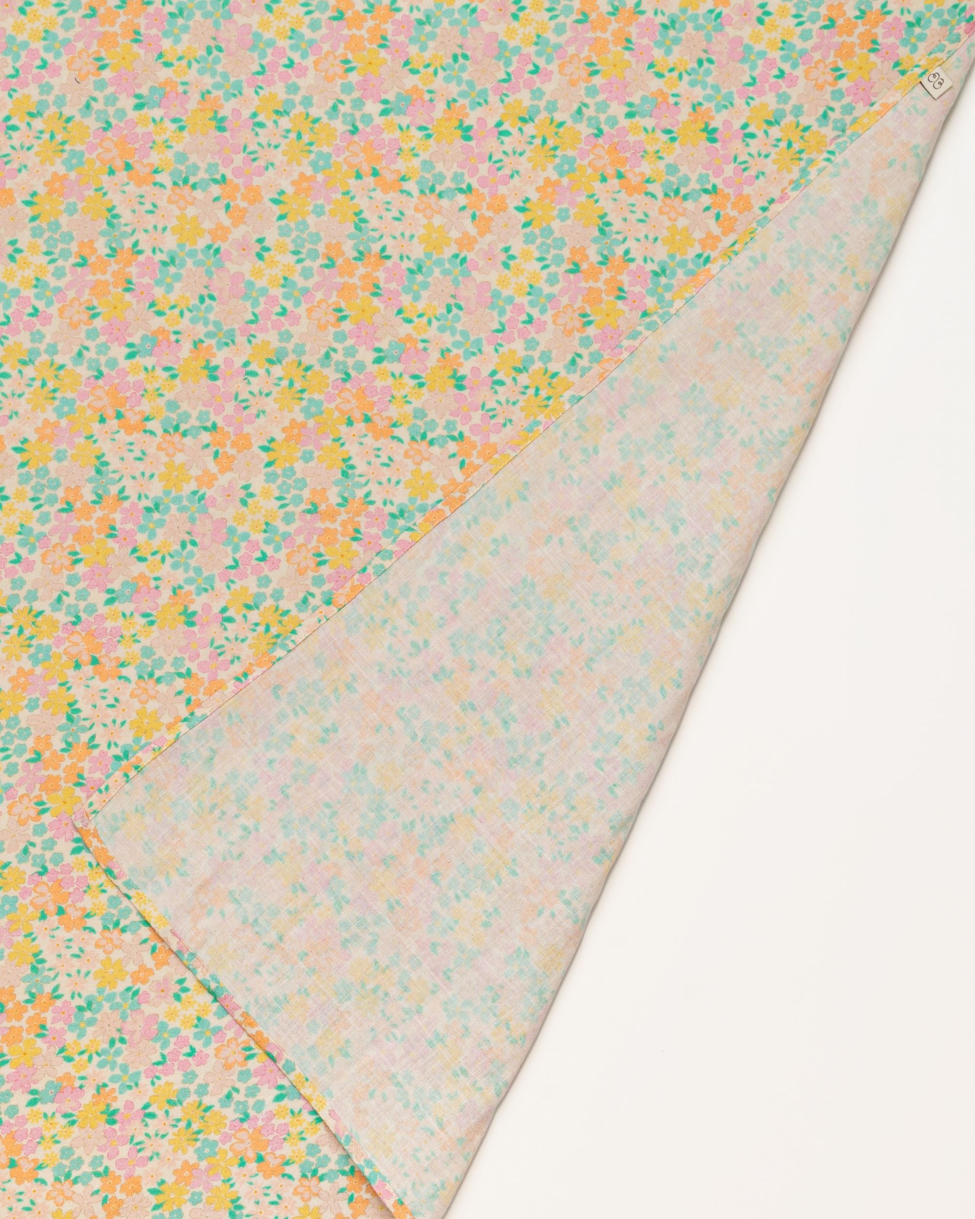 Early Sunday, Baby Napkin in Emma Floral Mint color, made from Printed Cotton Double Gauze fabric, shown in a closeup flat-lay view