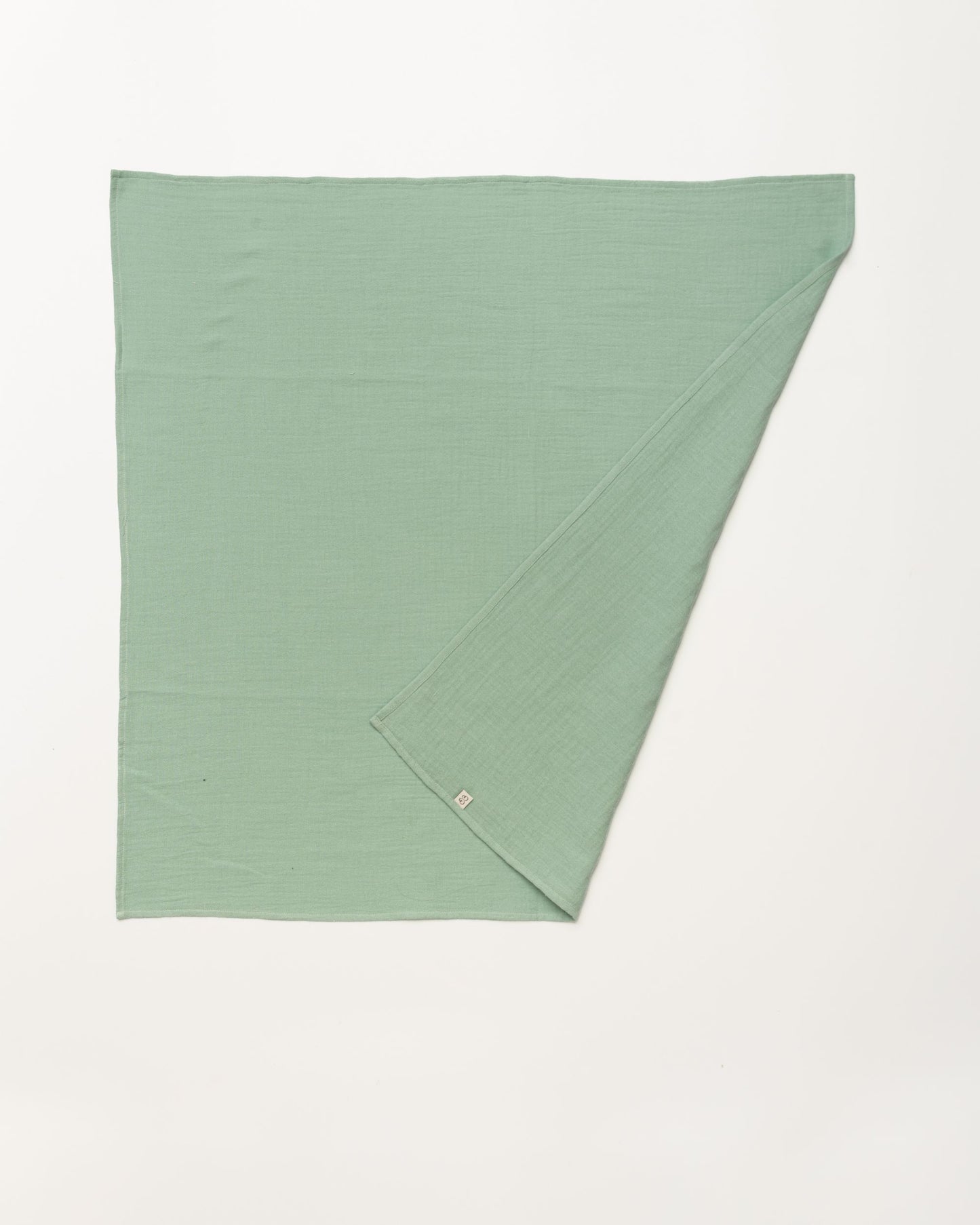Early Sunday, Baby Napkin in Mint color, made from Printed Cotton Double Gauze fabric, shown in a back flat-lay view