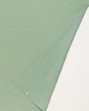 Early Sunday, Baby Napkin in Mint color, made from Printed Cotton Double Gauze fabric, shown in a closeup flat-lay view