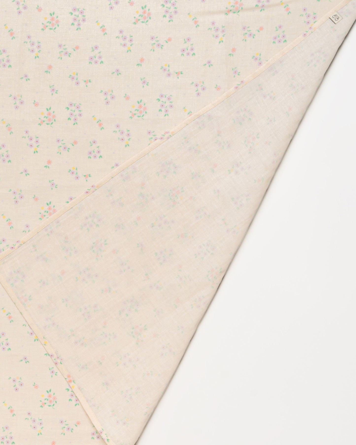 Early Sunday, Baby Napkin in Painted Bouquet print, made from Printed Cotton Double Gauze fabric, shown in a closeup flat-lay view