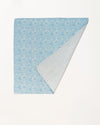 Early Sunday, Baby Napkin in Tonal Floral Blue color, made from Printed Cotton Double Gauze fabric, shown in a back flat-lay view