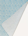 Early Sunday, Baby Napkin in Tonal Floral Blue color, made from Printed Cotton Double Gauze fabric, shown in a closeup flat-lay view