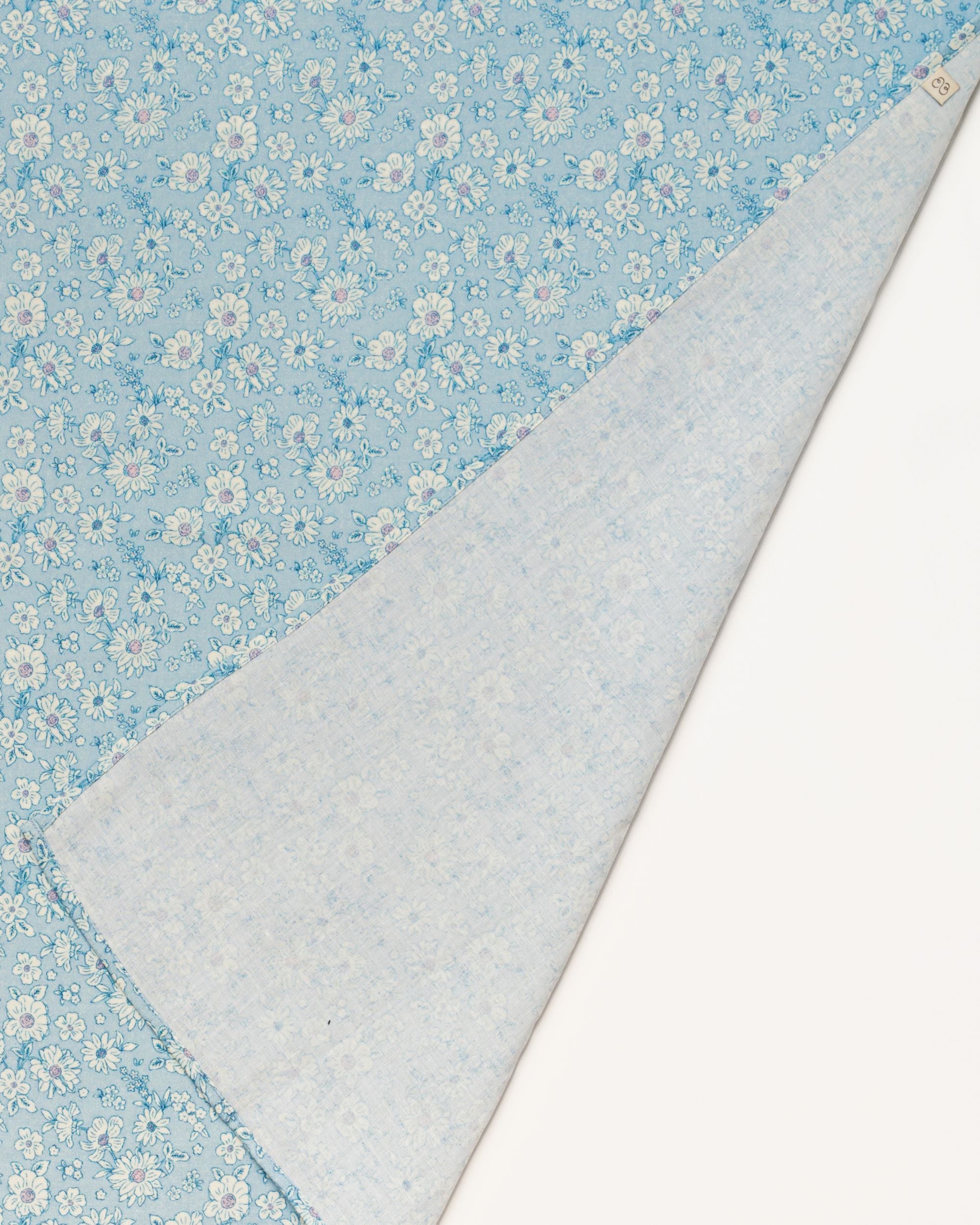 Early Sunday, Baby Napkin in Tonal Floral Blue color, made from Printed Cotton Double Gauze fabric, shown in a closeup flat-lay view