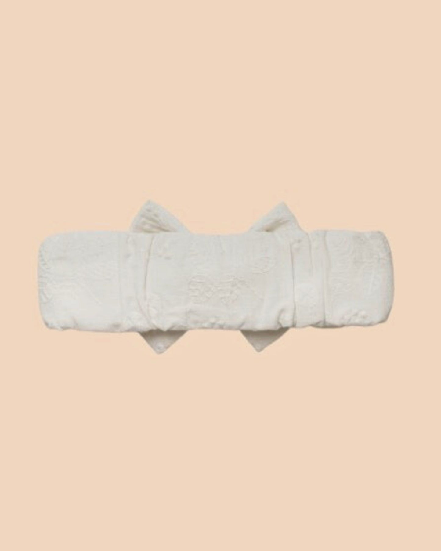 Early Sunday, Baby's Bow Headband in Ivory color, made from All-Over Embroidered Fabric fabric, featuring a wide bow design, shown in a back flat-lay view