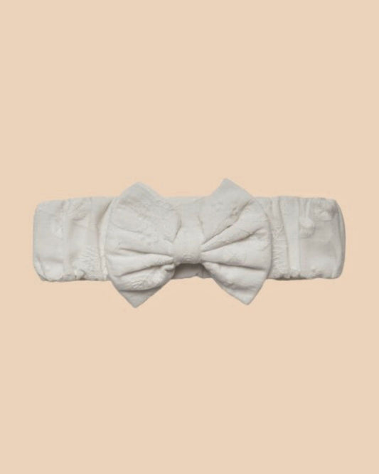 Early Sunday, Baby's Bow Headband in Ivory color, made from All-Over Embroidered Fabric fabric, featuring a wide bow design, shown in a front flat-lay view