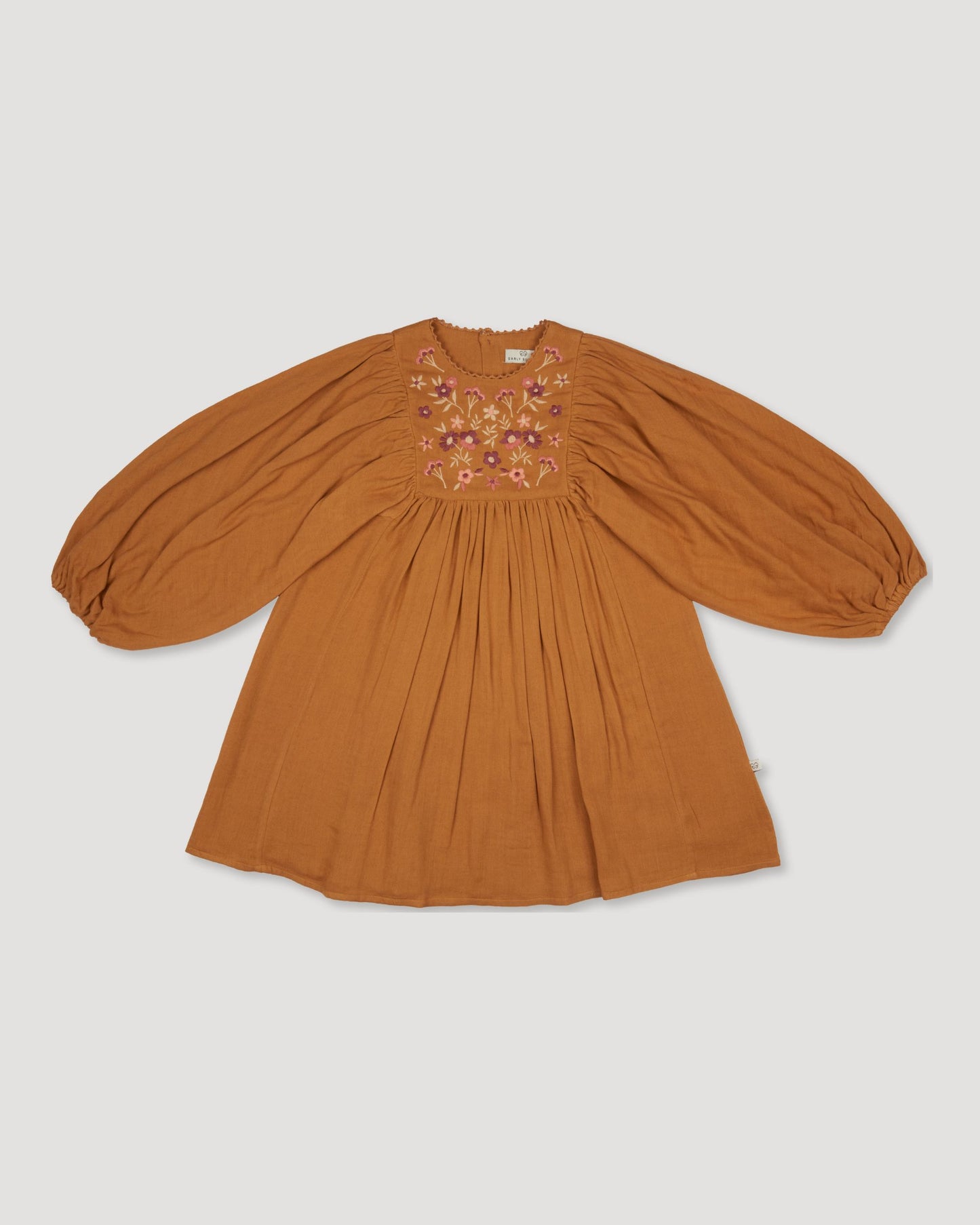 Early Sunday, Belle Dress in Almond, made from Dyed Cotton Double Gauze fabric, featuring Hand-embroidered floral bodice with voluminous puff sleeves for a soft, enchanting silhouette, shown in a front flat-lay view