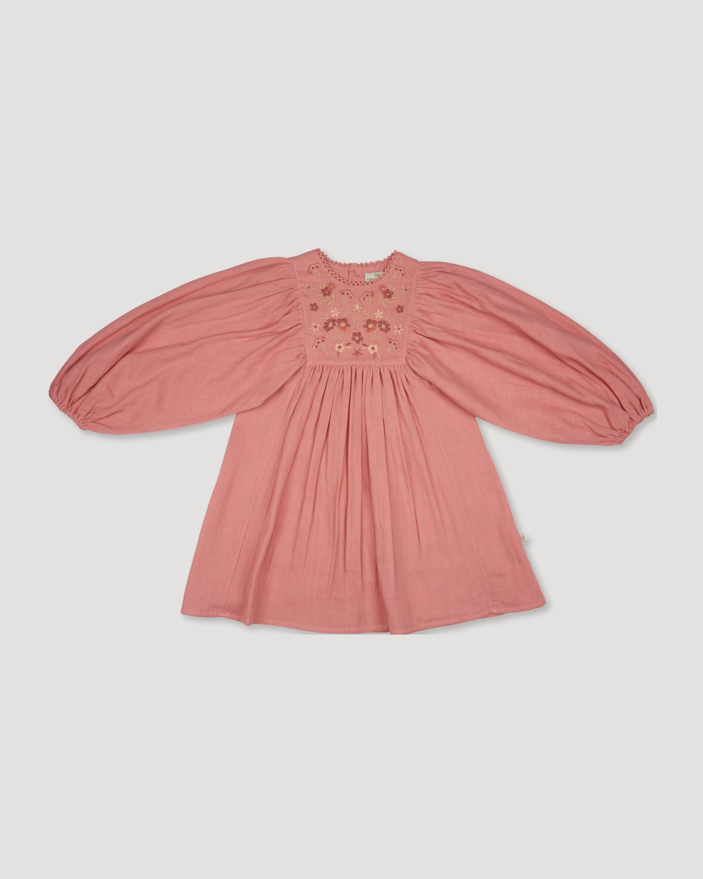 Early Sunday, Belle Dress in Rose, made from Dyed Cotton Double Gauze fabric, featuring Hand-embroidered floral bodice with voluminous puff sleeves for a soft, enchanting silhouette, shown in a front flat-lay view
