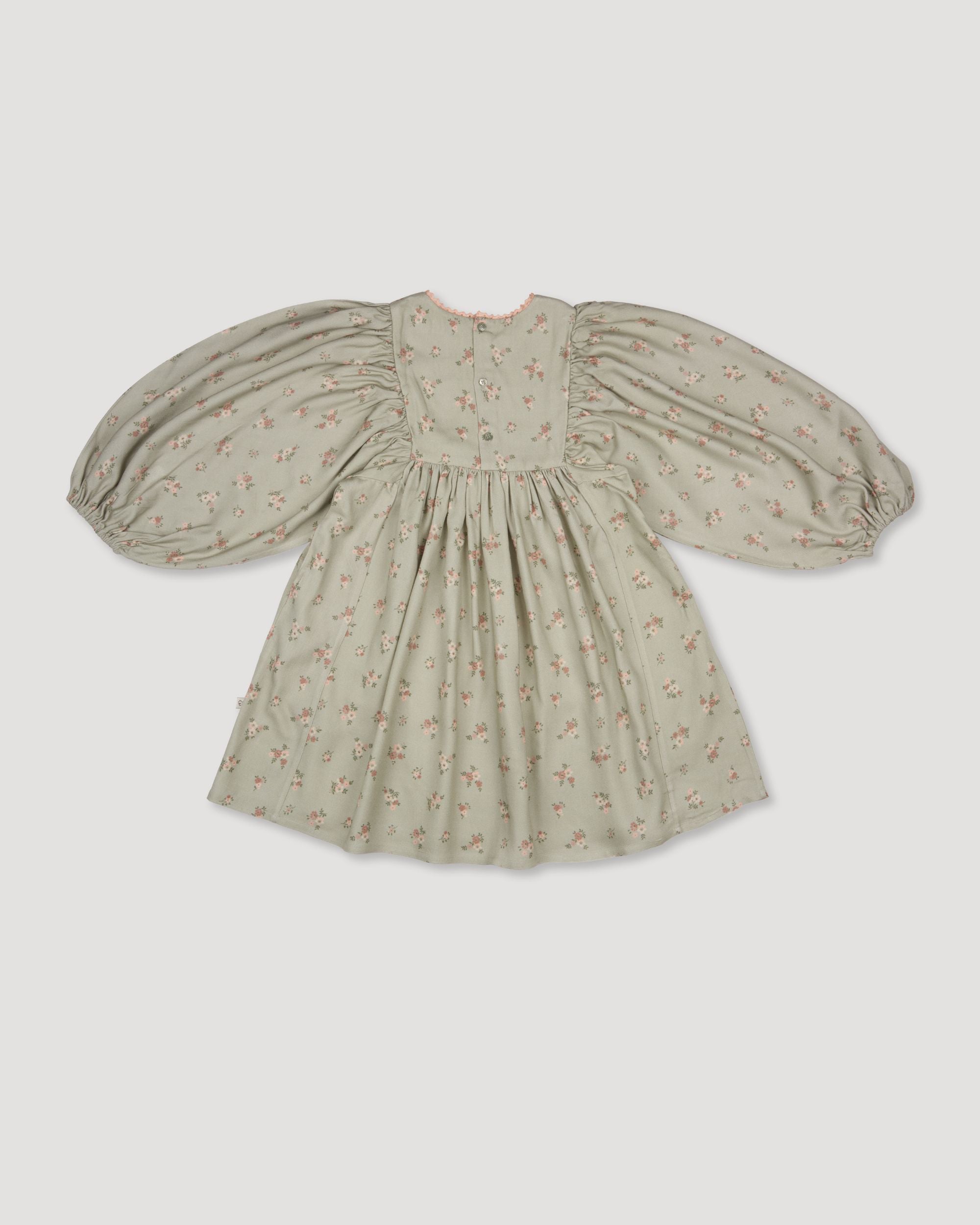 Early Sunday, Belle Dress in Ditsy Bouquet Jade print, made from Printed Viscose Rayon Twill fabric, featuring Hand-embroidered floral bodice with voluminous puff sleeves for a soft, enchanting silhouette, shown in a back flat-lay view