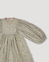 Early Sunday, Belle Dress in Ditsy Bouquet Jade print, made from Printed Viscose Rayon Twill fabric, featuring Hand-embroidered floral bodice with voluminous puff sleeves for a soft, enchanting silhouette, shown in a closeup flat-lay view