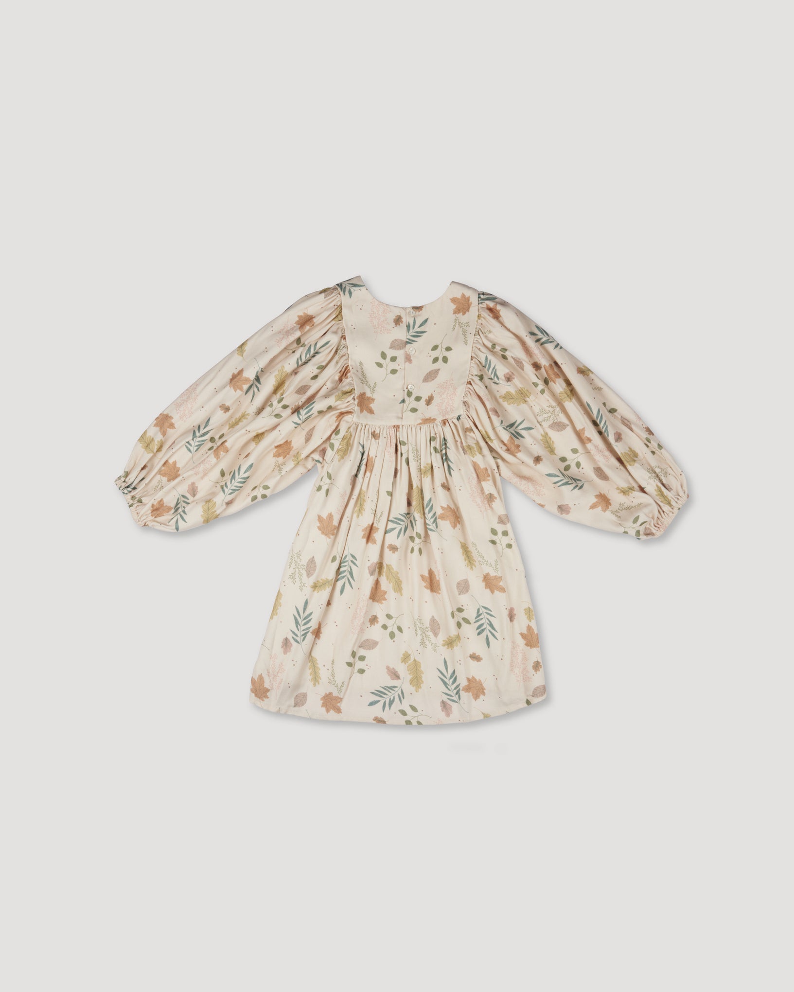 Early Sunday, Belle Dress in Falling Leaves Beige color, made from Printed Viscose Twill fabric, featuring a-line silhouette, bishop sleeves, back button closure, and mid-length, shown in a back flat-lay view